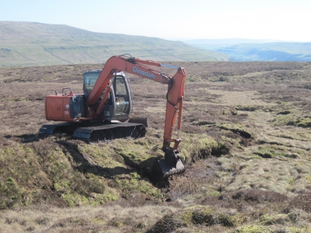 Image of peat slope reprofiling in progress © Tessa Levens