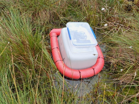 A "hovercraft" constructed from a Tupperware box and a swimfloat