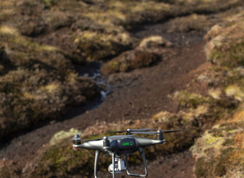 Quadcopter unmanned aerial vehicle surveying bare peat