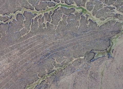 Aerial view of drainage channels dug into upland peatlands